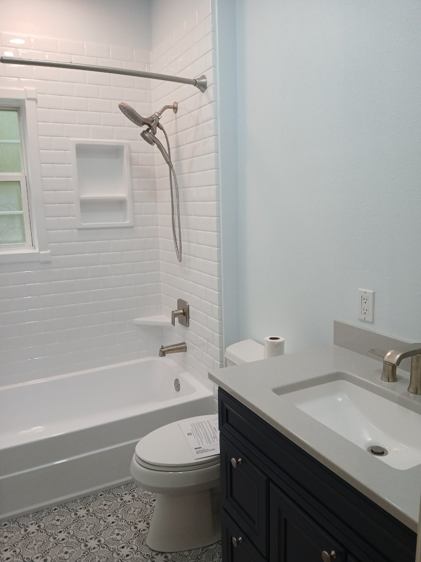 Bathroom renovation with subway tile and patterned floor